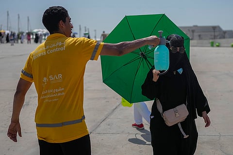 Pilgrim receives cold water spray
